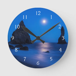 Moonrise reflection on ocean and sea stacks round clock