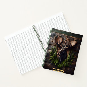Moose head mounted on rustic wooden wall in nature notebook