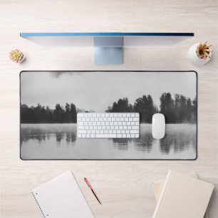 Morning fog above the lake in black and white desk mat
