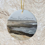 Morro Bay California Coastal Photography Ceramic Tree Decoration<br><div class="desc">A foggy overcast day in Morro Bay California with the ocean waves hitting the rocks on the shore in this beach photograph. This seaside travel photo Christmas ornament features black cursive script above the beach rocks and grey sky.</div>