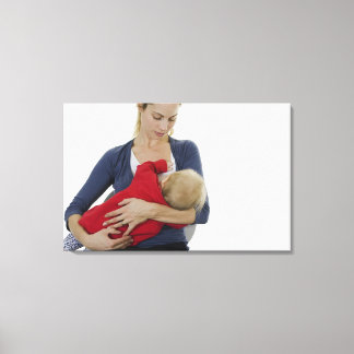 Mother breastfeeding her baby. canvas print