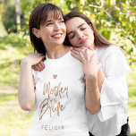 Mother of the bride copper glitter typography name T-Shirt<br><div class="desc">Glam elegant mother of the bride custom t-shirt with a copper brushed handwritten like typography script and a small heart.           Easy to personalise with her name.            Suitable for trendy modern glamourous wedding bridal parties.</div>