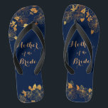 Mother of the Bride Gold Foliage Navy Blue Jandals<br><div class="desc">These gorgeous Mother of the Bride gold foliage navy blue flip flops have a dark blue background that is adorned with an intricate gold floral greenery pattern and customisable modern typography. The combination of the rich navy and the shimmering gold create an elegant and luxurious aesthetic. It's a beautiful gift...</div>