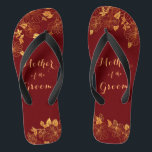 Mother of the Groom Dark Burgundy & Gold Foliage Jandals<br><div class="desc">The Mother of the Groom Dark Burgundy & Gold Foliage foliage flip flops have a dark burgundy background that is adorned with an intricate gold floral greenery pattern and customisable modern typography. The combination of the rich burgundy and the shimmering gold create an elegant and luxurious aesthetic. It's a beautiful...</div>
