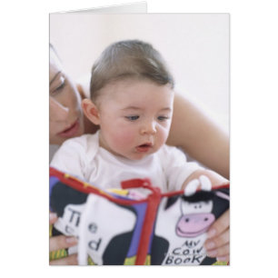 Mother reading to baby boy. Faces of a mother