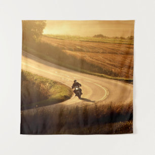 Motorcycle on countryside road at autumn evening. tapestry