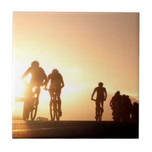 Mountain Bike Riders Make Their Way Over The Top Tile