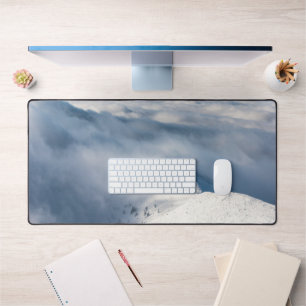 Mountains emerging from clouds desk mat
