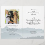 Mountains Folded Wedding Photo Program Template<br><div class="desc">Misty mountains folded wedding program template with a photo area. Blue-grey mountain scenery covers the bottom third of the paper on all the pages. Customise text on front and back of 8.5 x 11 inch paper that will be folded in half after purchase. The photo of the couple will appear...</div>