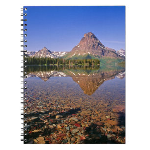 Mountains reflect into calm Two Medicine Lake in Spiral Notebook