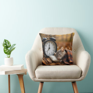 Mouse Sleeping By an Alarm Clock Cushion