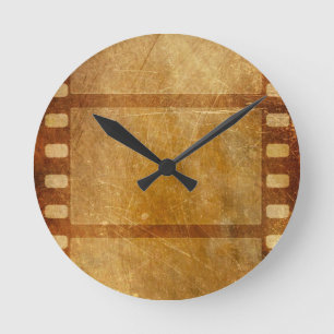 MOVIE REEL OLD-FASHIONED GRUNGE GOLD BACKGROUND DI ROUND CLOCK