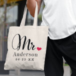 Mr Elegant Script Heart Custom Wedding Monogram Tote Bag<br><div class="desc">Personalized Mr tote bag for the newly married groom features elegant modern black script and classic style last name and wedding date monogram text that can be personalized. Design includes a cute red heart detail. Makes a great wedding gift for the honeymoon! Shop our store for the coordinating Mrs bag...</div>