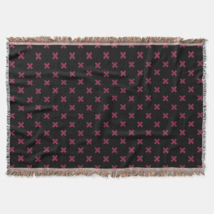 Mulberry cross stitches on black throw blanket