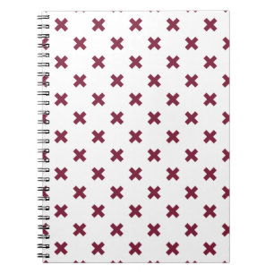 Mulberry cross stitches on white notebook