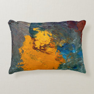 multi-colored strokes of oil paint on the artist's decorative cushion