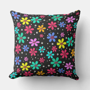 Multi-coloured daisies on a black background cushion