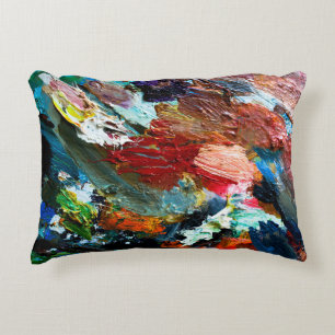 multi-coloured strokes of oil paint on the artist' decorative cushion