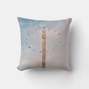 Multicolored amusement park ride under white cloud cushion