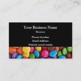 Multicolored candy or sweet pattern on black business card