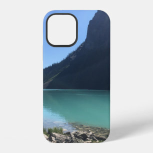 MULTICOLORED CANOES MOORED IN DOCK IN LAKE iPhone 12 CASE