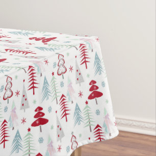 Multicolored Christmas trees on a white Tablecloth