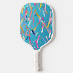 Multicolored confetti background on blue pickleball paddle