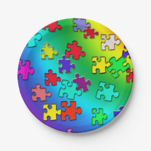 Multicolored jigsaw puzzles pieces paper plate