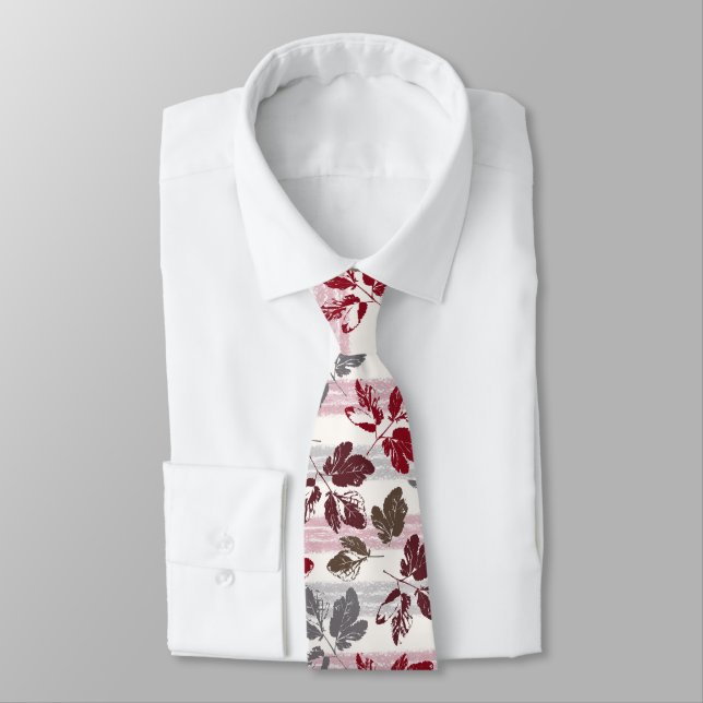 Multicolored leaves on a striped background. tie (Tied)