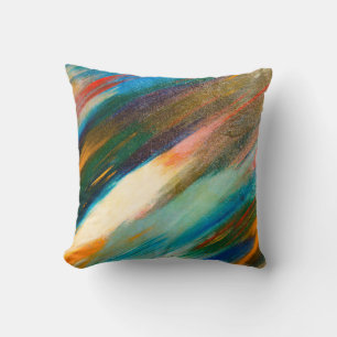 Multicolored long diagonal watercolor strokes on t cushion