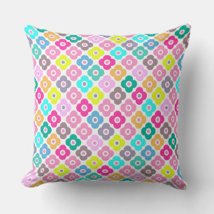 Multicolored rustic flower pattern on white cushion