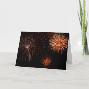Multiple bursts of Fireworks against black Card