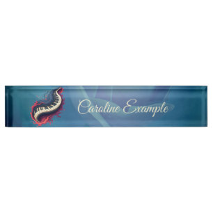 Music in motion, the curved piano. nameplate