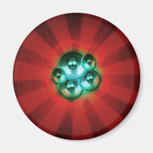 Music speakers and red sunburst magnet