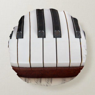 musical notes on the background of a pianoacoustic round cushion
