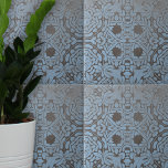 Muted Grey Blue Floral and Geometric Patterns Tile<br><div class="desc">This ceramic tile showcases an intricate and symmetrical design that is a harmonious fusion of floral and geometric patterns. Delicate leaves and blossoms are elegantly intertwined, creating a captivating visual experience. The design is set against a muted grey background, with vibrant blue patterns providing a striking contrast. This complex yet...</div>