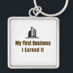 My First Business Keychain – I Earned It – Proud F<br><div class="desc">Celebrate the pride of launching your very first business! This keychain features the bold phrase "My First Business – I Earned It", perfect for anyone who worked hard to achieve this milestone. Whether it’s a startup, small business, or entrepreneurial venture, this keychain is a fun and meaningful reminder of dedication...</div>