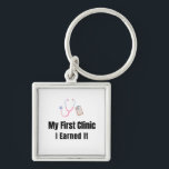 My First Clinic Keychain – I Earned It – Proud Fir<br><div class="desc">Celebrate the pride of owning your very first clinic! This keychain features the bold phrase "My First Clinic – I Earned It", perfect for anyone who worked hard to achieve this milestone. Whether it’s your first medical practice, dental office, or clinic space, this keychain is a fun and meaningful reminder...</div>