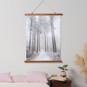 Mysterious road in a frozen foggy forest hanging tapestry