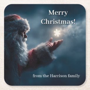 Mysterious Santa Claus Blowing a Glowing Snowflake Square Paper Coaster
