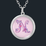 N monogram decorative letter necklace<br><div class="desc">Pretty letter N monogram pendant. Whimsical letter drawing of the capital initial letter N ideal for gifting girls with a name that begins with N. Background colour can be changed if required,  currently light pink. © Original drawing and design by Sarah Trett www.sarahtrett.com for www.mylittleeden.com</div>