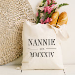 Nannie Roman Numeral Year Established Tote Bag<br><div class="desc">A modern minimalist tote bag to celebrate a chic grandma,  this clean minimal tote features "Nannie" or your choice of grandma nickname in black serif lettering. Customise with the year she became a grandmother beneath in elegant roman numerals for a chic touch.</div>