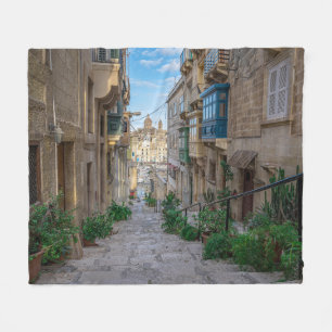 Narrow stone street in Malta Fleece Blanket
