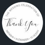 Natasha Handwritten Script Wedding Favour Thank Yo Classic Round Sticker<br><div class="desc">Use these simple yet elegant, black and white stickers on your favours. The minimalist design features your names, wedding date and the words "Thank you" written in a modern sans serif font accented with a handwritten calligraphy script font. Designed to match my stylish Natasha wedding collection. Be sure to browse...</div>
