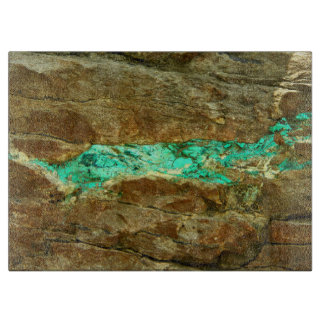 Natural turquoise vein in rough brown stone cutting board