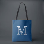 Nautical Blue White Monogram Tote Bag<br><div class="desc">This tote is sure to become a favourite! Designed in a beautiful shade of nautical blue,  this tote bag can be customised with a monogram or initial of your choice. Makes a great tote for the beach,  a vacation,  travel,  books,  crafts,  or for your everyday bag.</div>