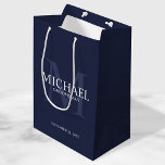 Nautical Navy Blue Personalised Groomsmen Medium Gift Bag<br><div class="desc">Add a personal touch to your wedding with personalised groomsmen gift bag. This gift bag features personalised groomsman's name with title and wedding date in white and monogram in light navy blue as background, in classic serif font style, on navy blue background. Also perfect for best man, father of the...</div>