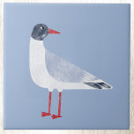 Nautical Seagull Bird Sky Blue Tile<br><div class="desc">A fun and cheeky black headed gull standing by the ocean. Perfect for those who love the coast. Original art by Nic Squirrell.</div>