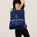Nautical Wedding Maid of Honour Custom Anchor Tote Bag<br><div class="desc">Surprise your Maid of Honour with this personalised tote bag featuring a nautical design with a white anchor set against a navy background. Customise by adding her name and your wedding date. A great size for wedding essentials: extra clothing, shoes, snacks, water, etc. The perfect go-to bag for a nautical,...</div>