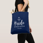 Nautical Wedding White Anchor Personalised Bride Tote Bag<br><div class="desc">Surprise the Bride with this personalised tote bag featuring a nautical design with a white anchor set against a navy background. Customise by adding her name and wedding date. A great size for wedding essentials: extra clothing, shoes, snacks, water, etc. The perfect go-to bag for a nautical, beach or destination...</div>